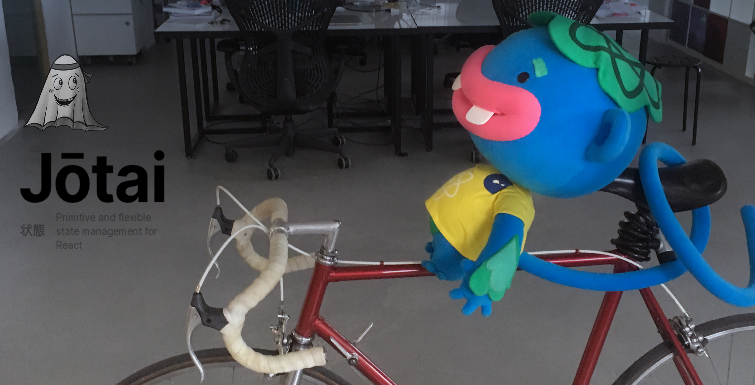 The Despark React monkey on a bike with the Jotai logo